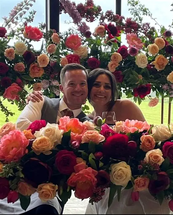 Couple surrounded by roses