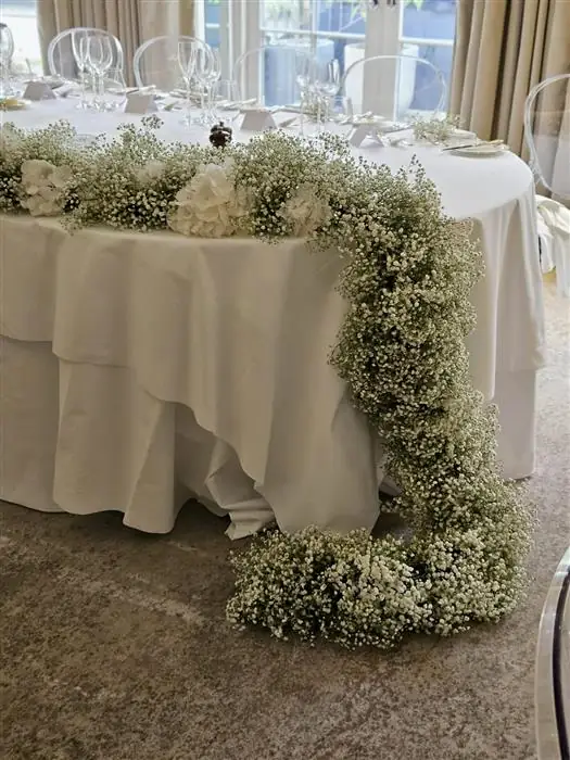 Top table draped in gypsophila
